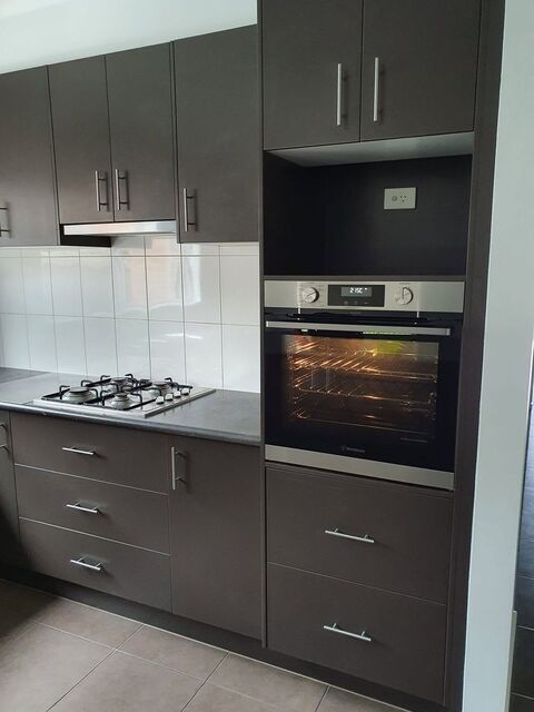 New kitchen with a wall oven, gas cooktop and a power point in the appliance cavity