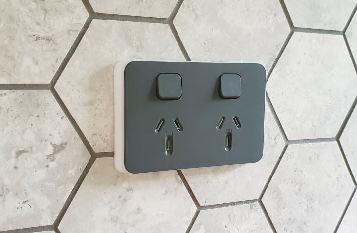Charcoal double power point installed on a hexagonal tile splashback